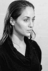 Actress-Rae-Varela-headshot-with-hair-pulled-back